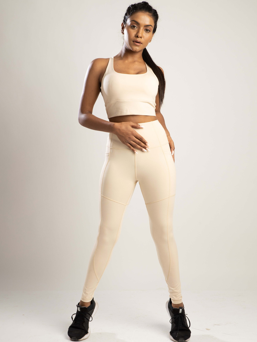 

SKNZ Women Beige Solid Sports Top & Tights Set