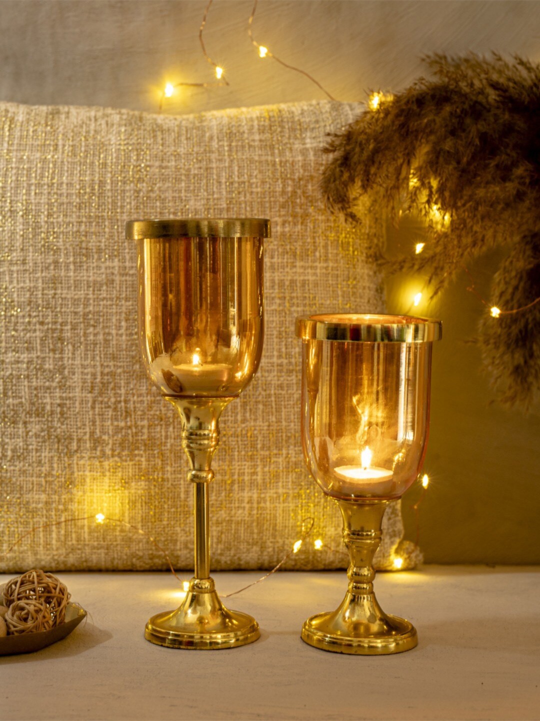 

The 7 DeKor Gold-Toned Solid Glass Candle Holder