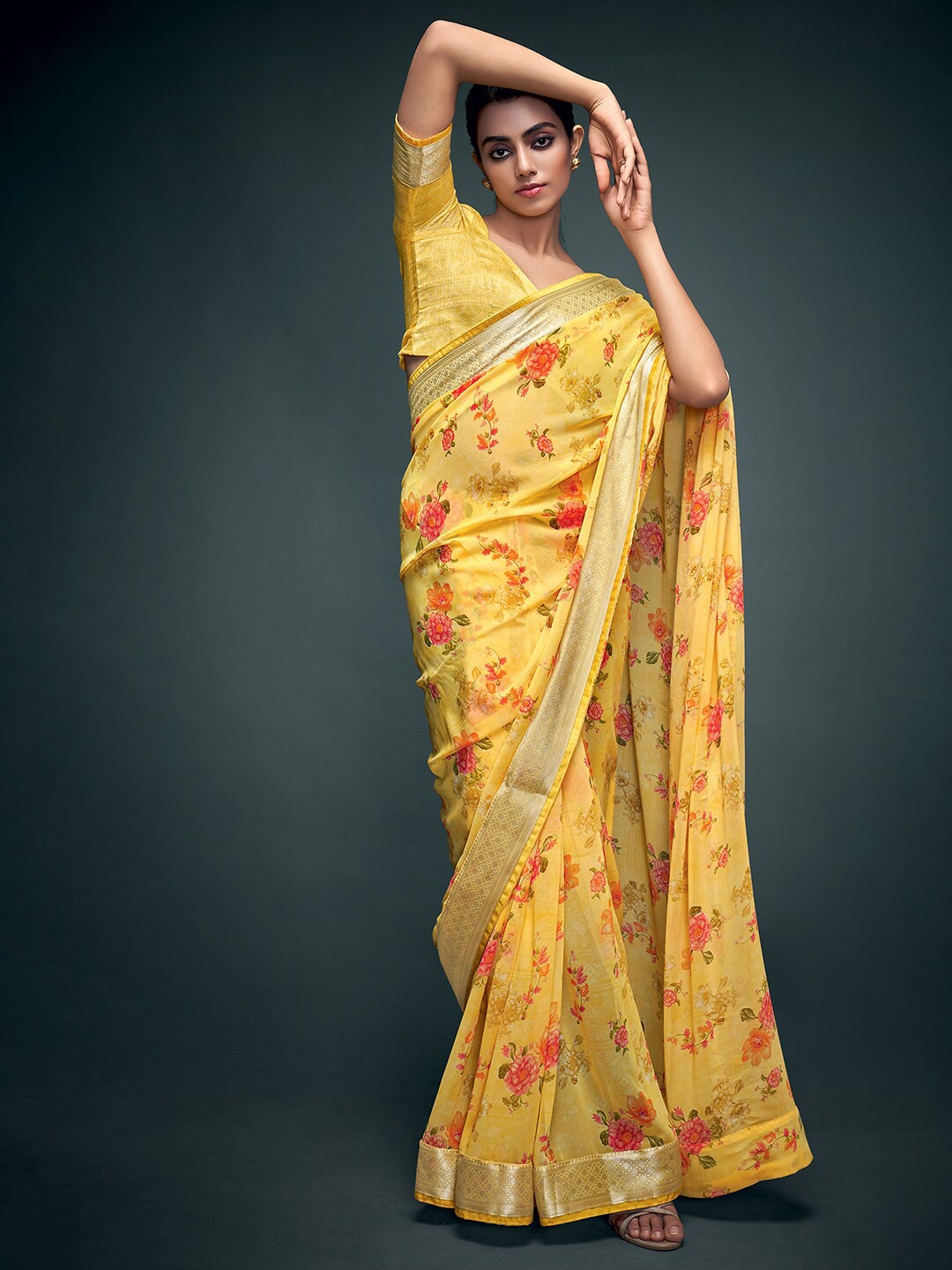 

Mitera Yellow & Orange Floral Zari Pure Georgette Banarasi Sarees
