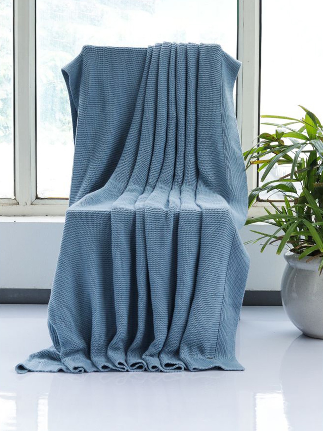 

Pluchi Blue Solid Knitted Cotton Throws