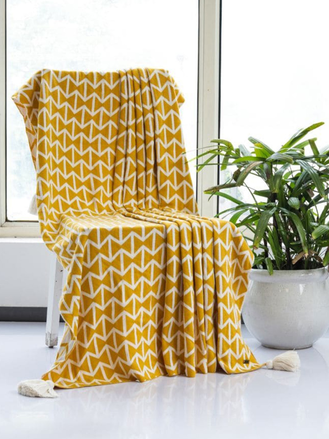 

Pluchi Mustard Printed Combed Cotton Throw