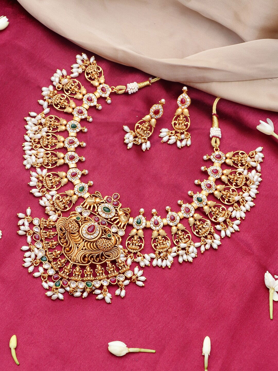 

Ishhaara Brass-Plated Gold-Toned & Pink Stone-Studded & Beaded Jewellery Set