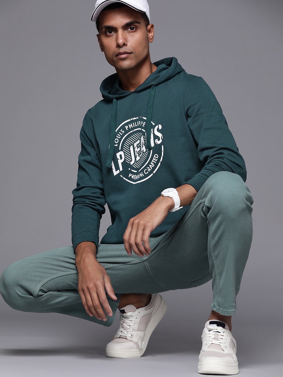 

Louis Philippe Jeans Men Teal Green & White Printed Hooded Sweatshirt