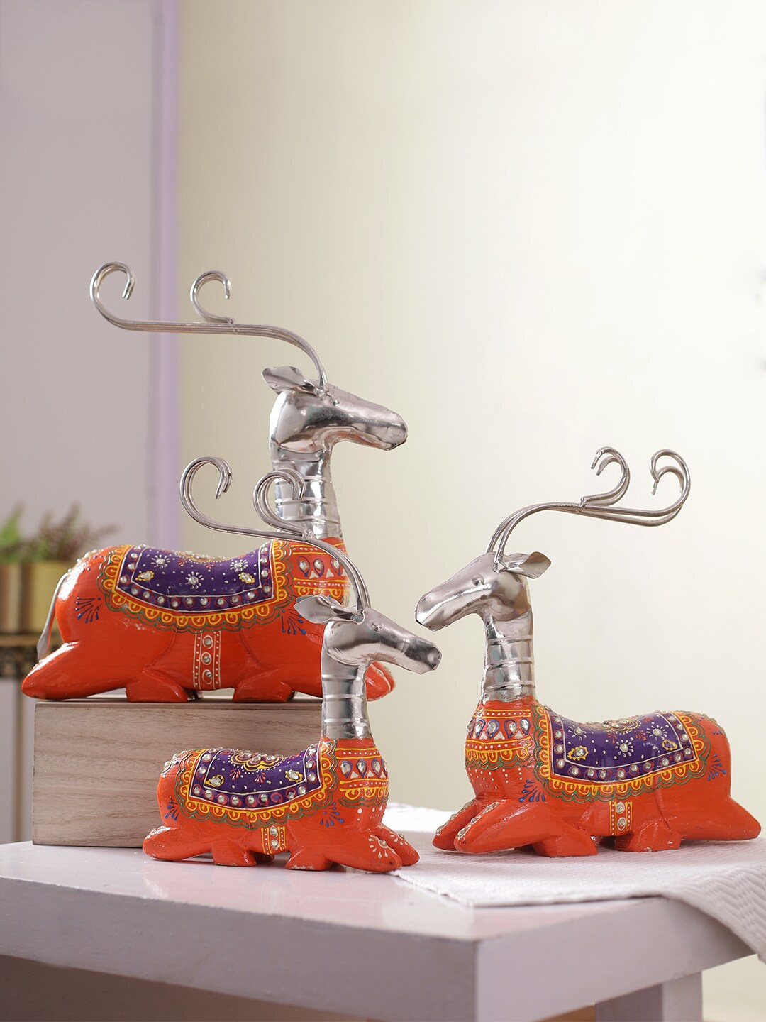 

Aapno Rajasthan Set of 3 Orange & Blue Reindeer Showpieces