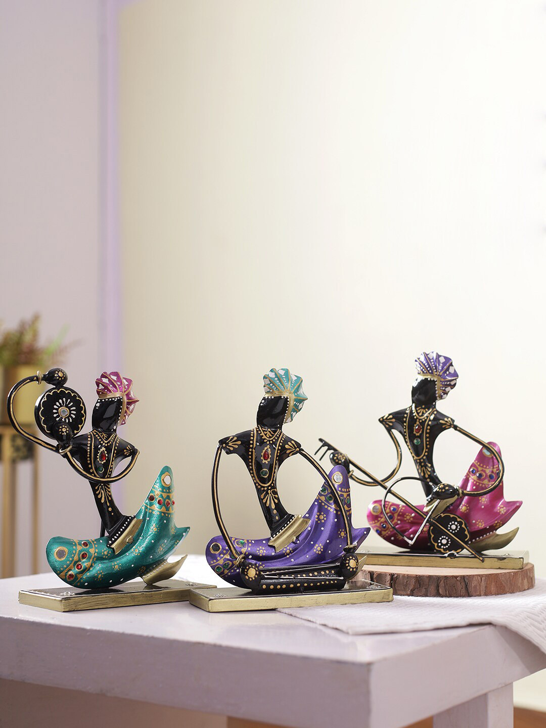 

Aapno Rajasthan Set Of 3 Blue Green & Pink Traditional Sitting Musicians Showpieces