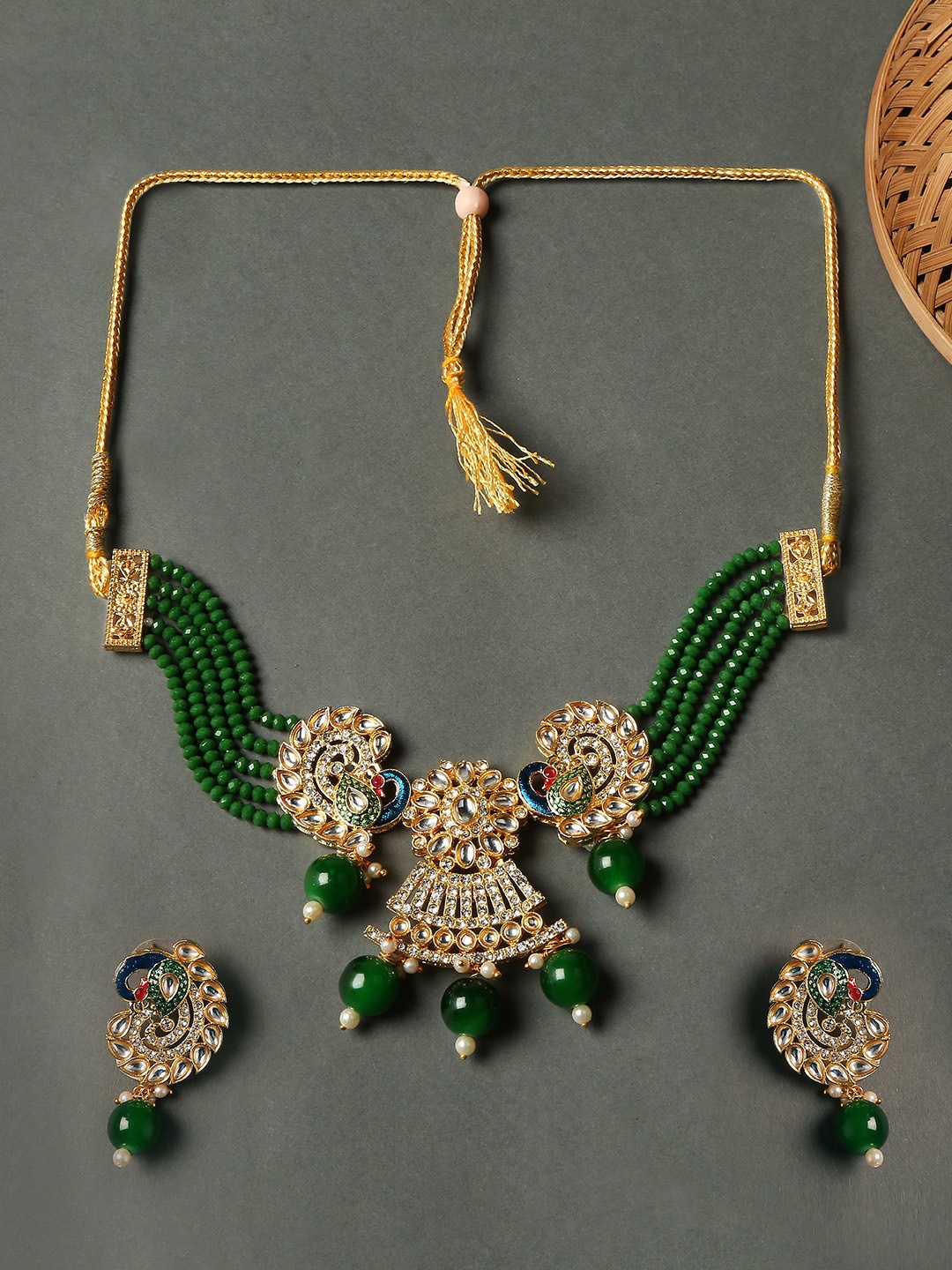 

OOMPH Gold-Toned Green Kundan Peacock Design Studded and Beaded Jewellery Set