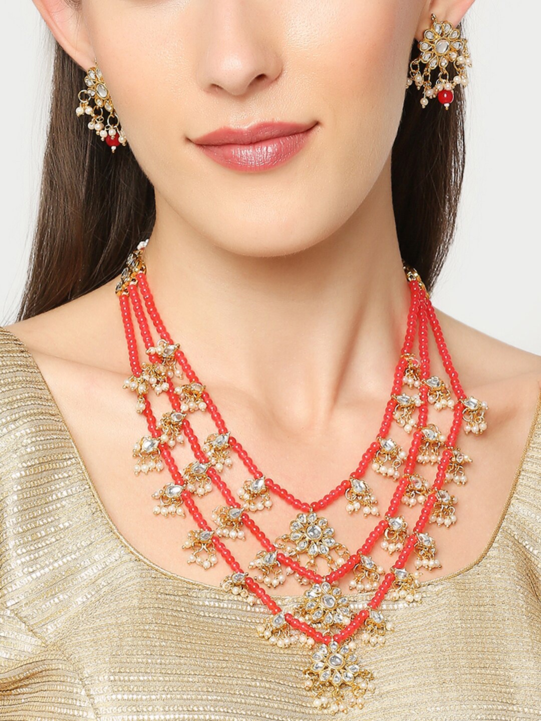 

OOMPH Gold-Toned Red and White Kundan Studded and Beaded Jewellery Set