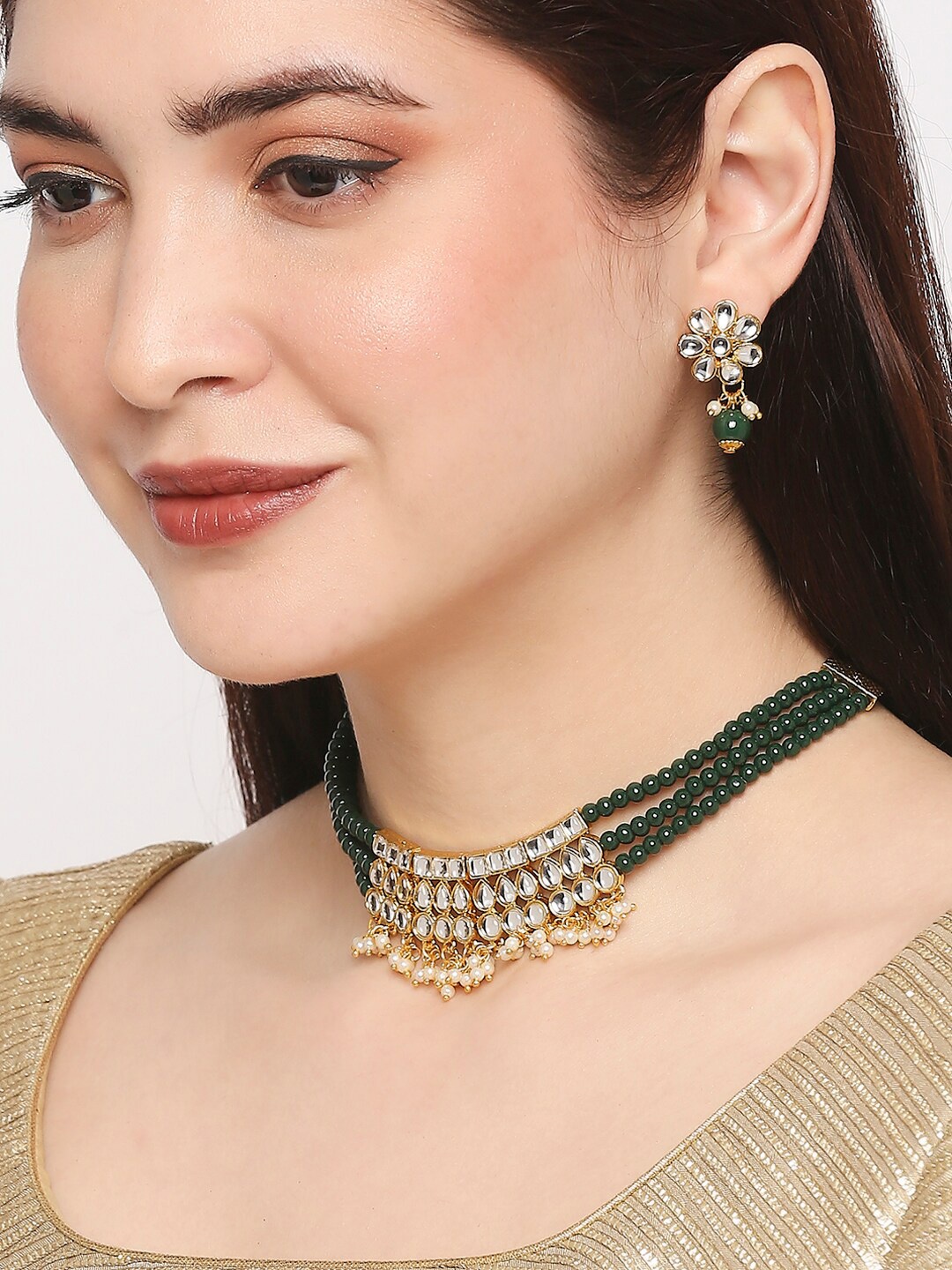 

OOMPH Gold-Toned Green & White Kundan Studded and Beaded Jadau Jewellery Set