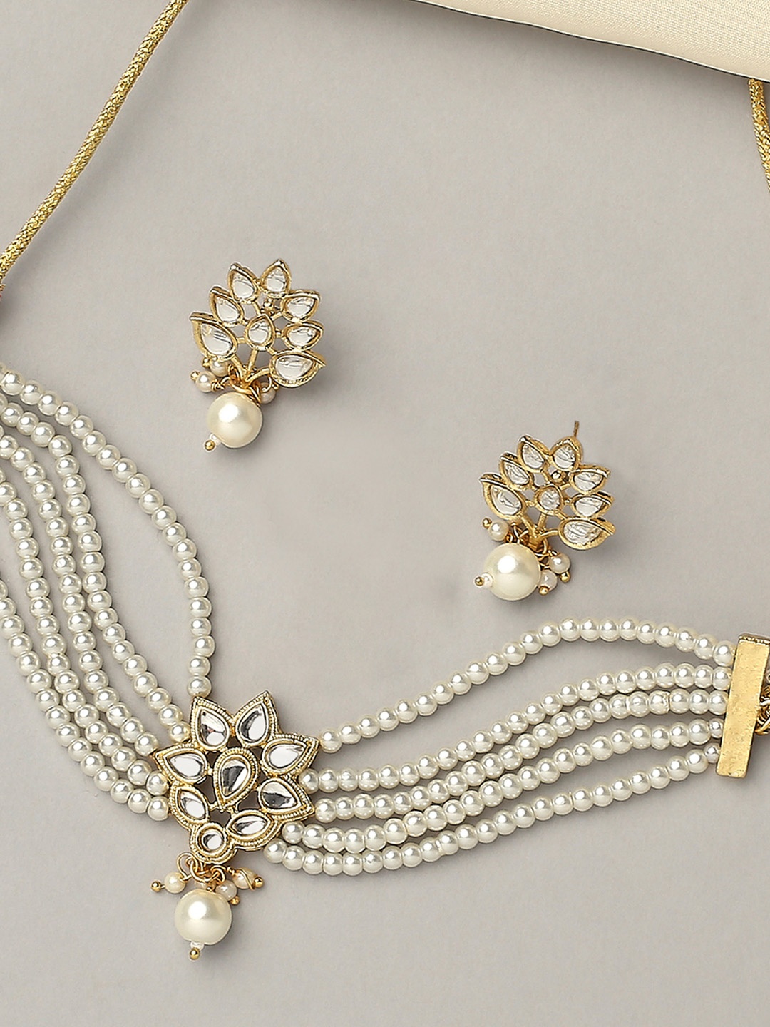 

OOMPH Gold-Toned White Kundan Studded and Beaded Layered Jewellery Set