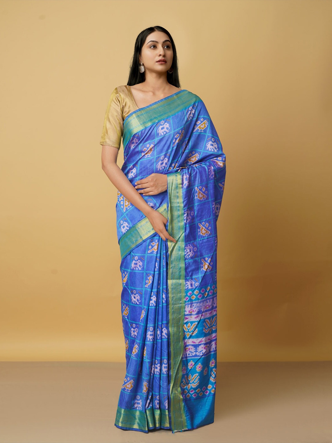 

Unnati Silks Blue & Gold-Toned Ethnic Motifs Zari Art Silk Patola Saree