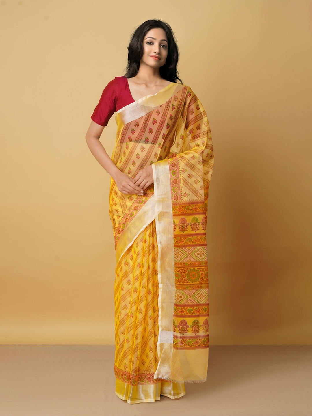 

Unnati Silks Yellow & Red Ethnic Motifs Zari Organza Saree