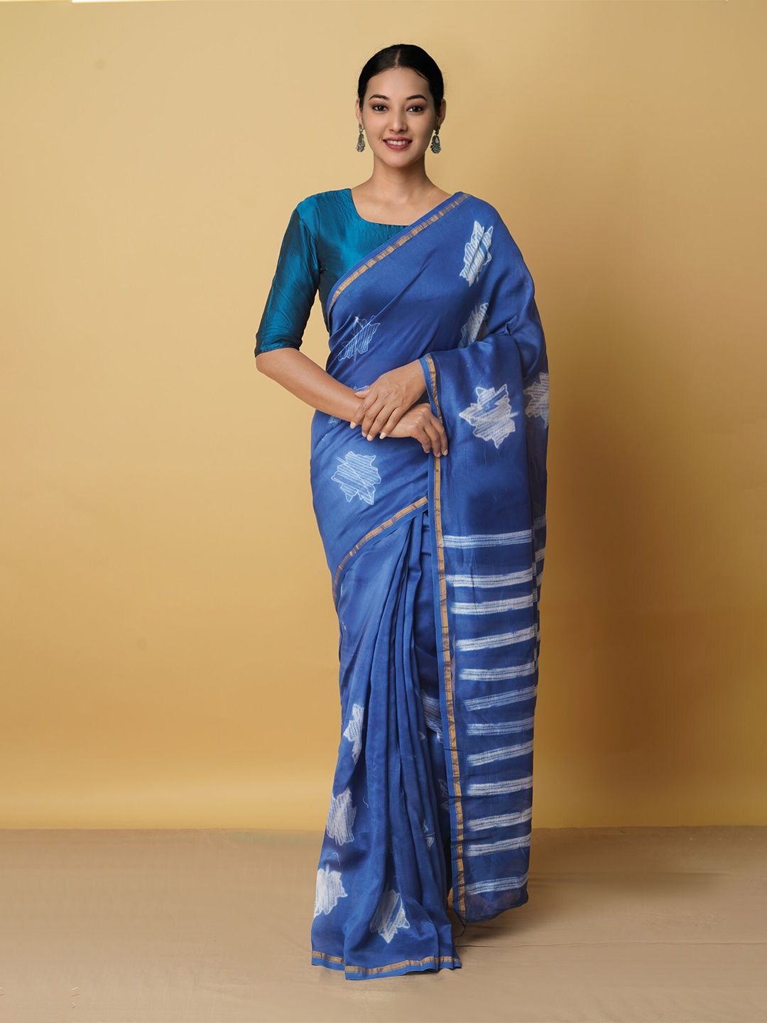 

Unnati Silks Blue & White Floral Zari Silk Cotton Chanderi Saree