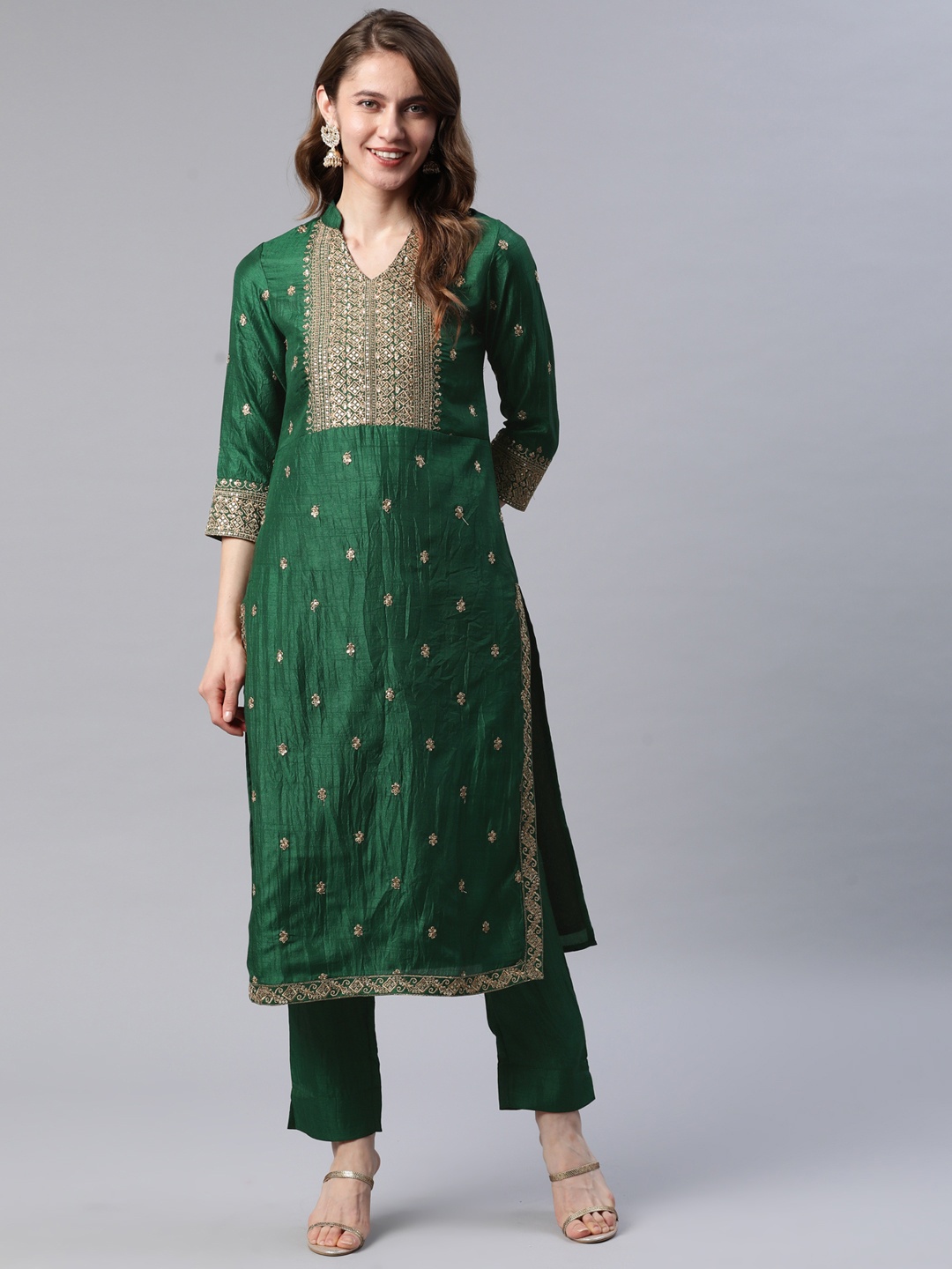 

Cottinfab Women Green & Golden Ethnic Motifs Sequinned Kurta with Trousers