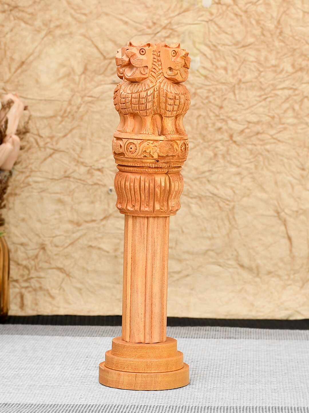

RDK Beige Wooden Ashoka Stambh Showpiece