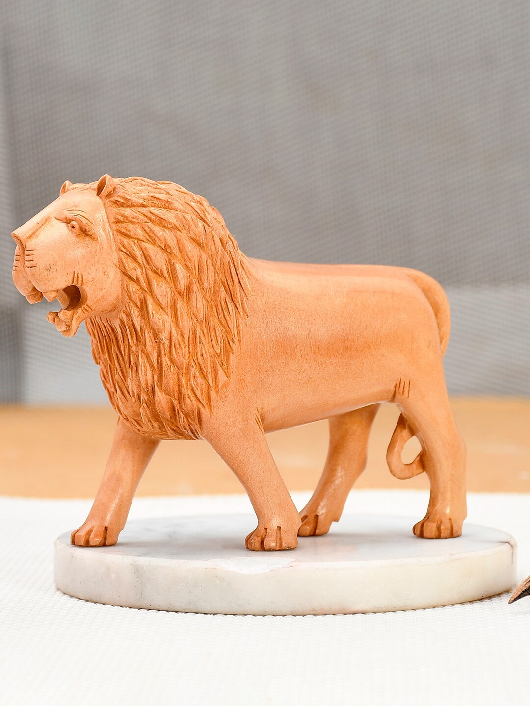 

RDK Beige Lion King Wooden Decorative Showpiece