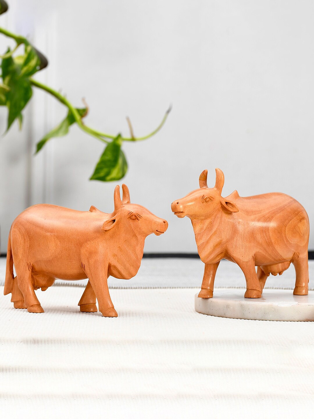 

RDK Set Of 2 Beige Colored Holy Cow Wooden Showpieces
