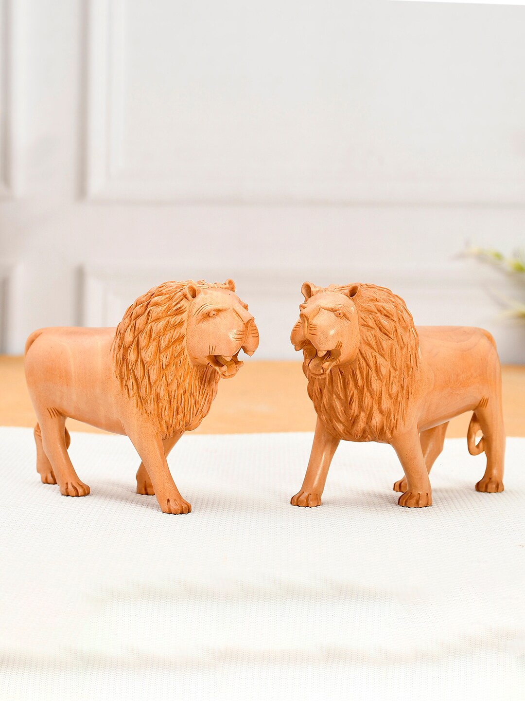 

RDK Set Of 2 Beige Solid Lion Eye Catching Showpieces