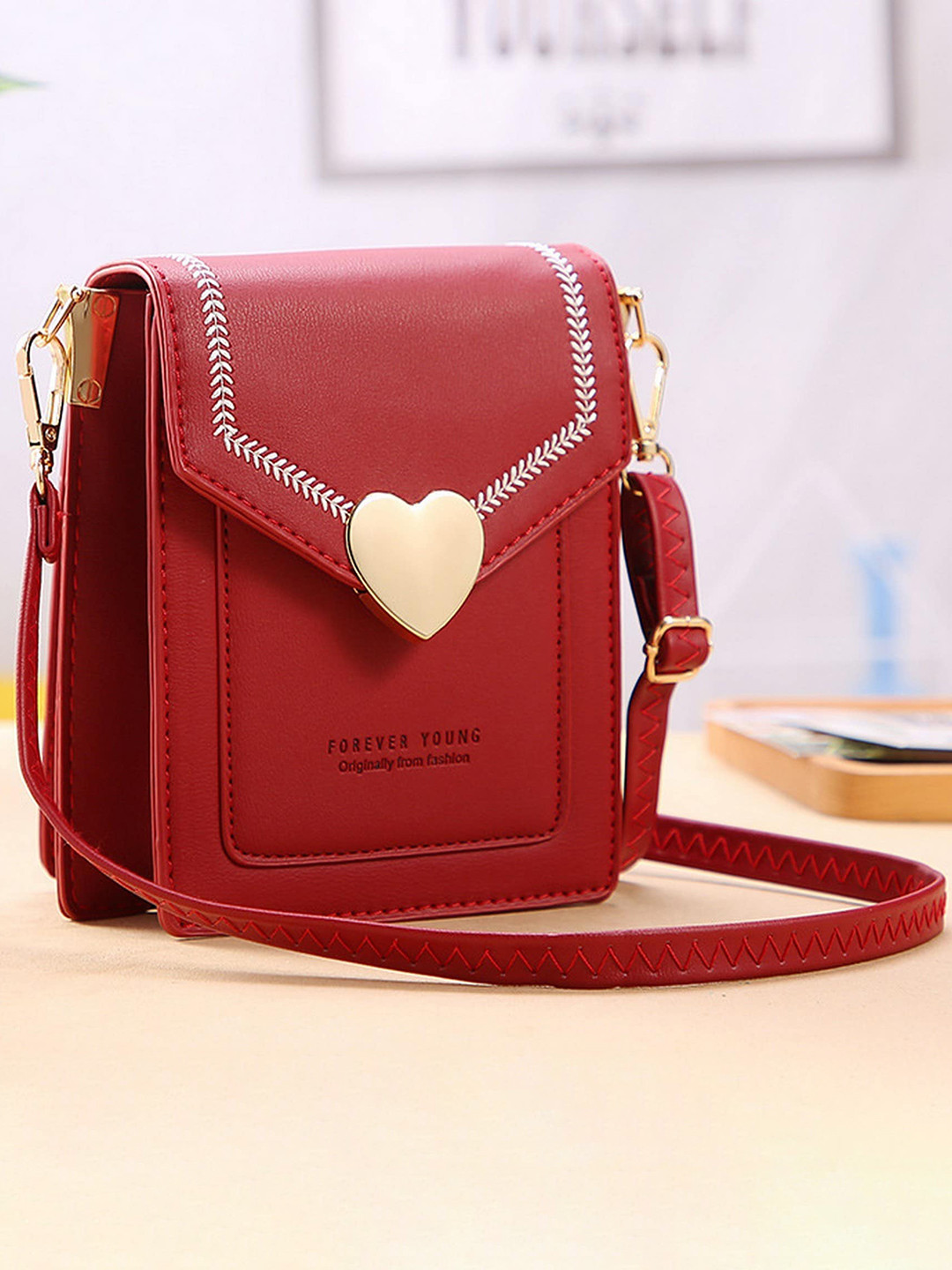 

Diva Dale Red PU Structured Sling Bag with Tasselled