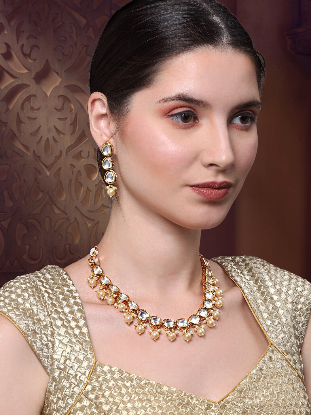 

Yellow Chimes Gold-Plated White Kundan-Studded & Pearl Beaded Jewellery Set