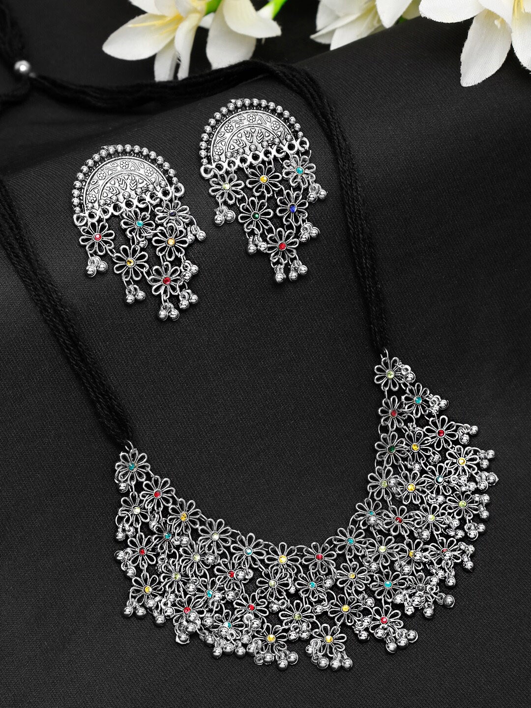 

Yellow Chimes Oxidised Silver-Plated Red & Yellow Stoned Studded Ghungroo Beaded Jewellery Set