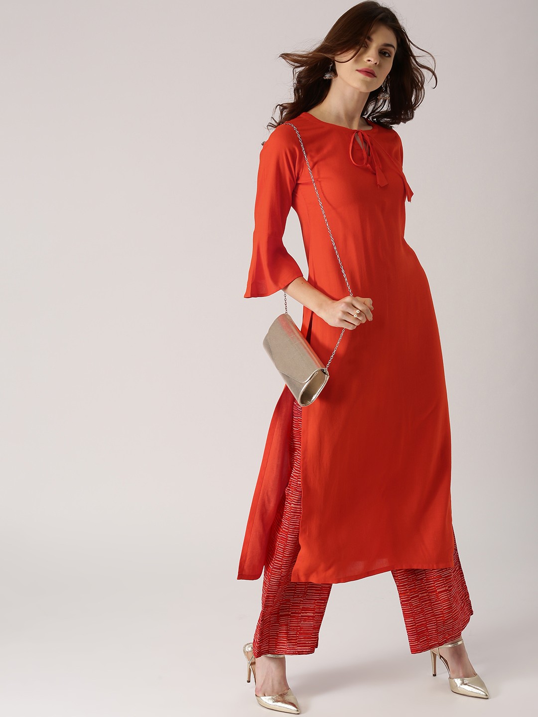 

Libas Women Orange Solid Straight Kurta