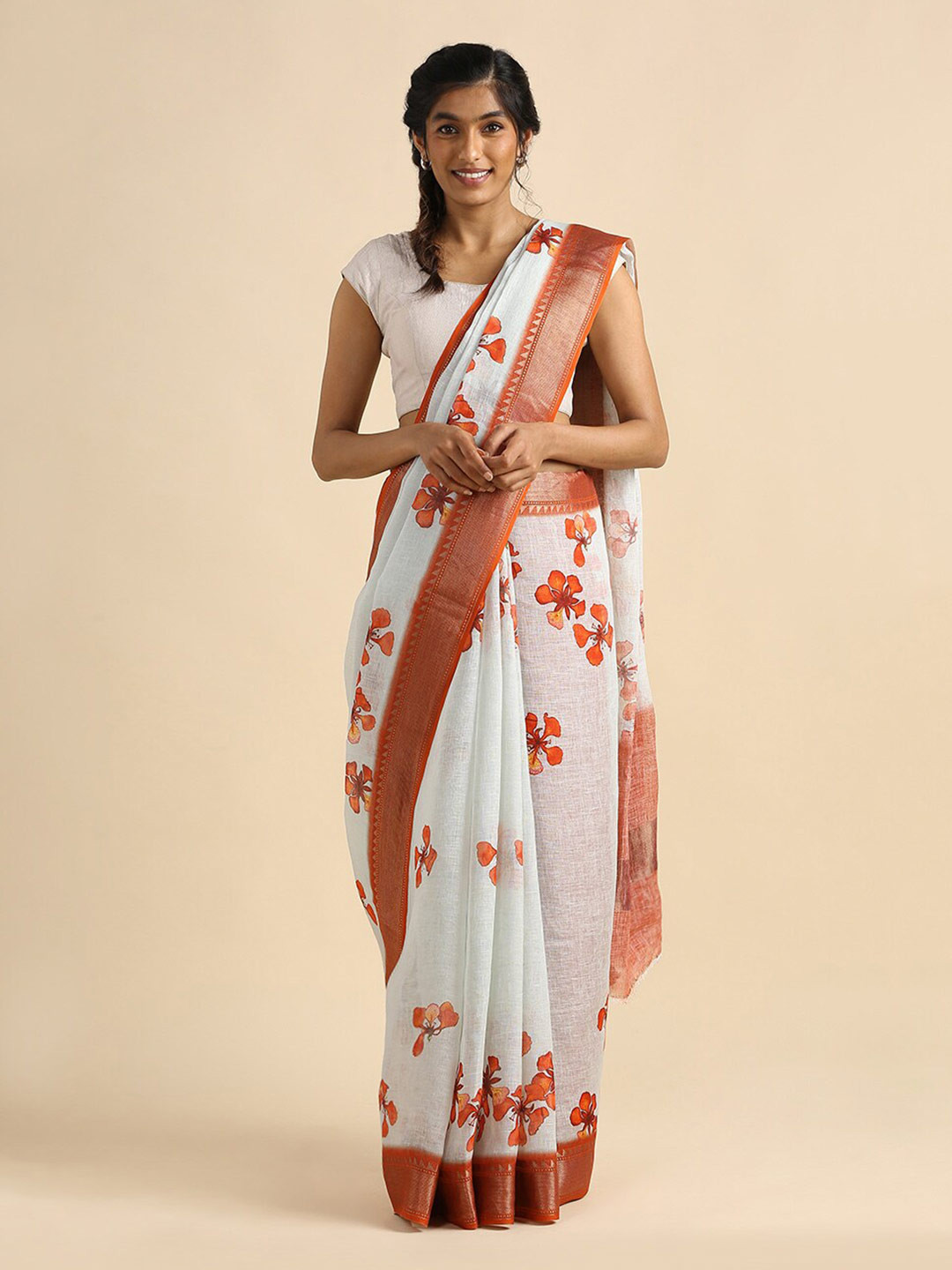

Taneira Off White & Orange Floral Zari Pure Linen Saree