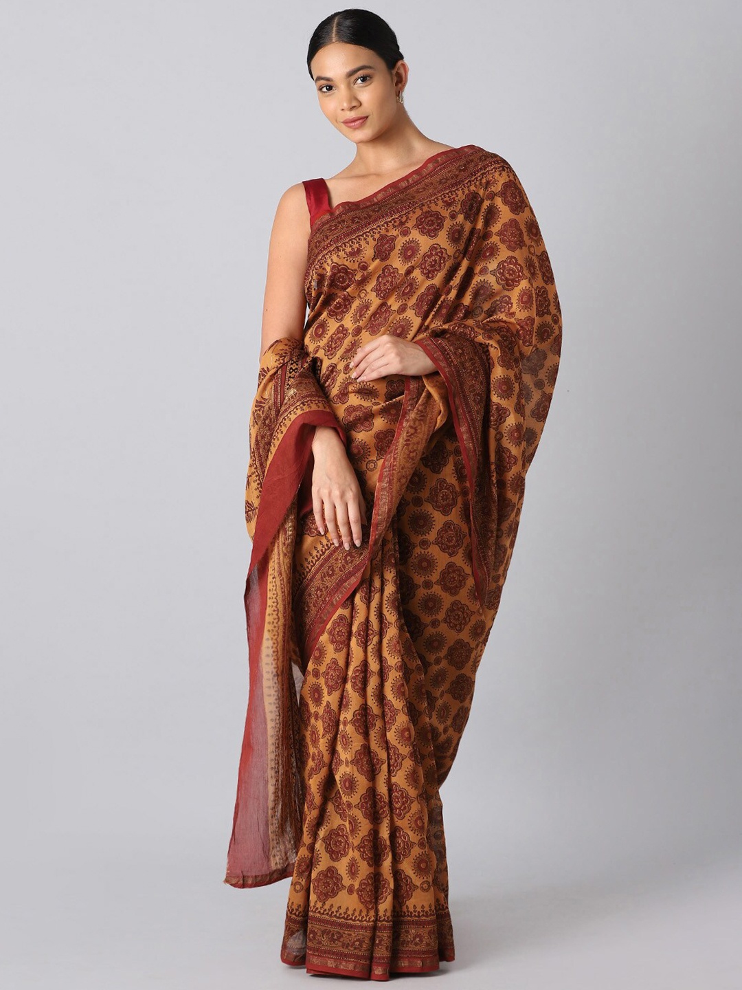 

Taneira Orange & Mustard Ethnic Motifs Silk Cotton Bagru Saree