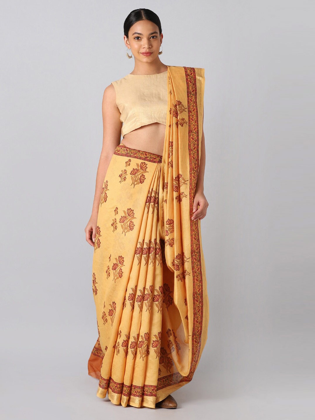 

Taneira Orange & Pink Floral Zari Silk Cotton Saree