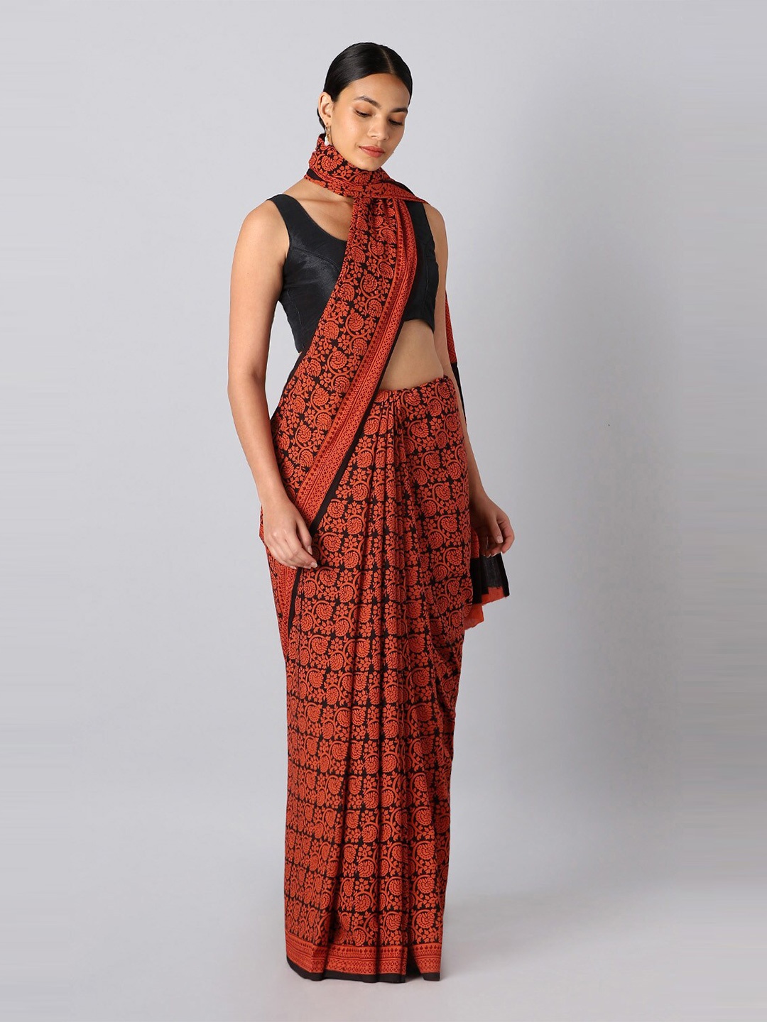 

Taneira Orange & Black Floral Pure Cotton Bagh Saree