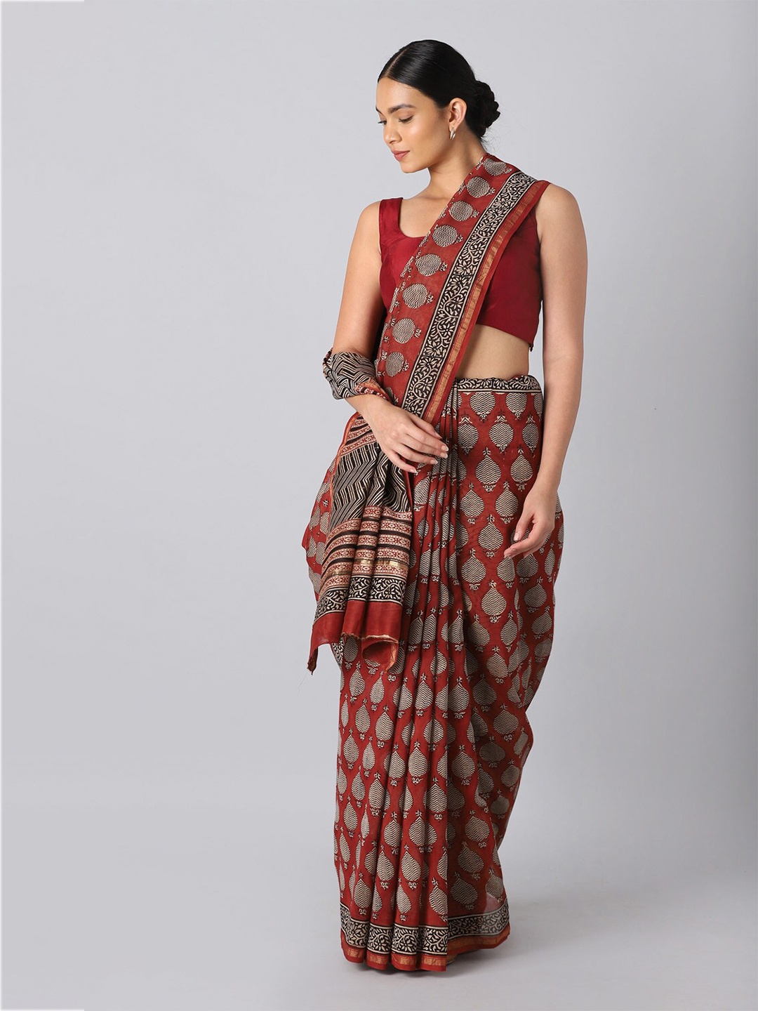 

Taneira Red & Brown Ethnic Motifs Zari Silk Cotton Bagru Saree