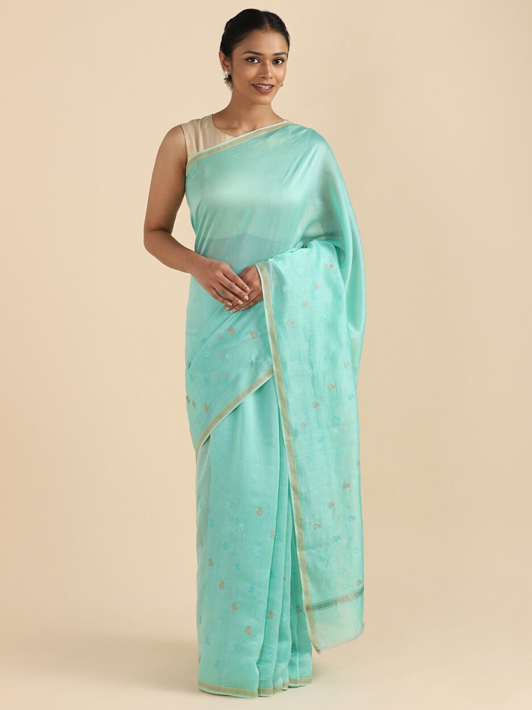

Taneira Green & Purple Woven Design Zari Silk Cotton Saree