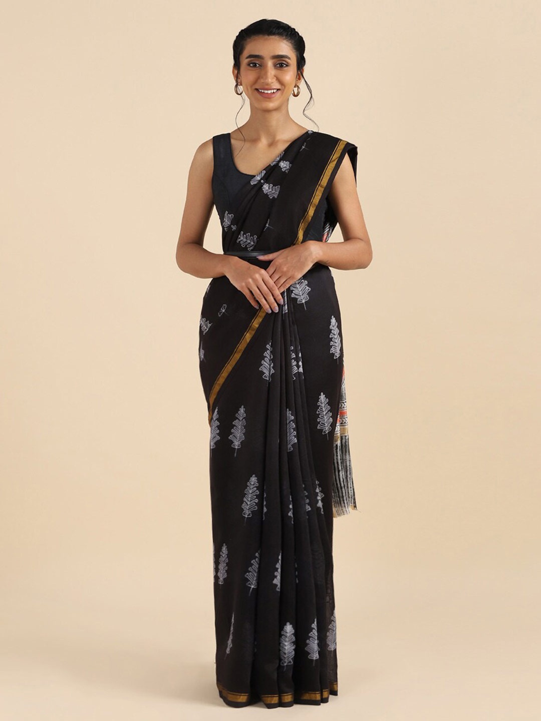 

Taneira Black & White Ethnic Motifs Zari Silk Cotton Saree