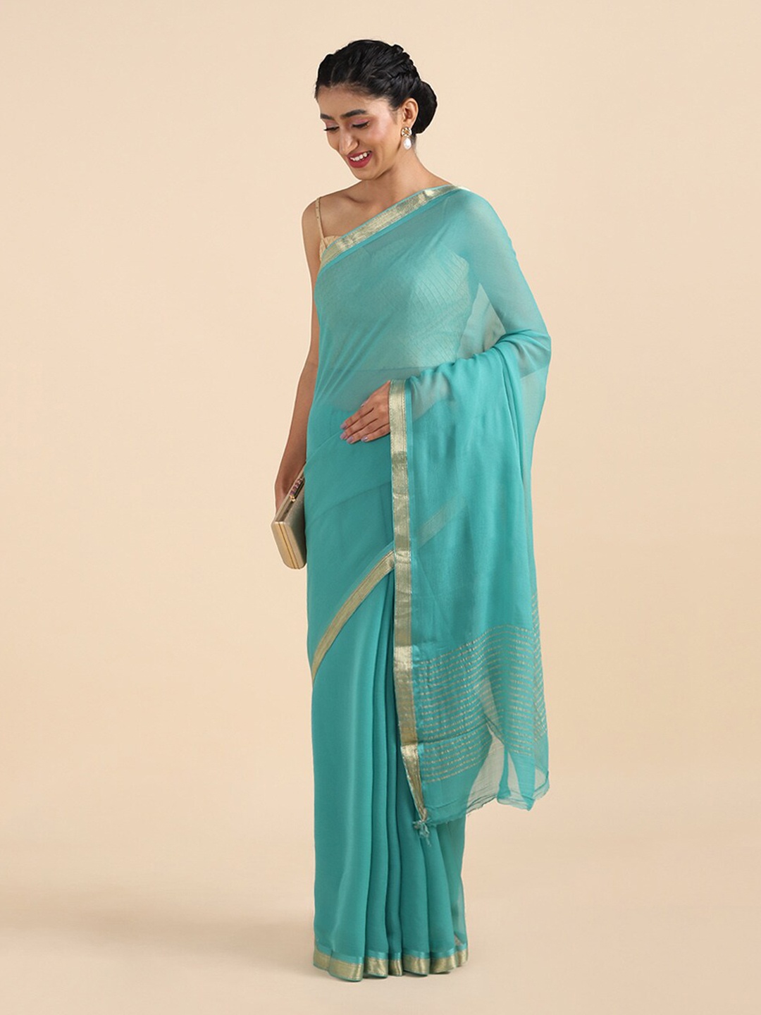 

Taneira Sea Green & Gold-Toned Zari Pure Chiffon Saree