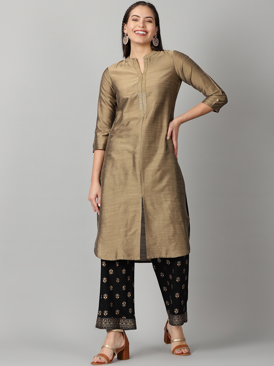 

Saffron Threads Women Gold-Toned Ethnic Motifs Thread Work Kurta with Palazzos