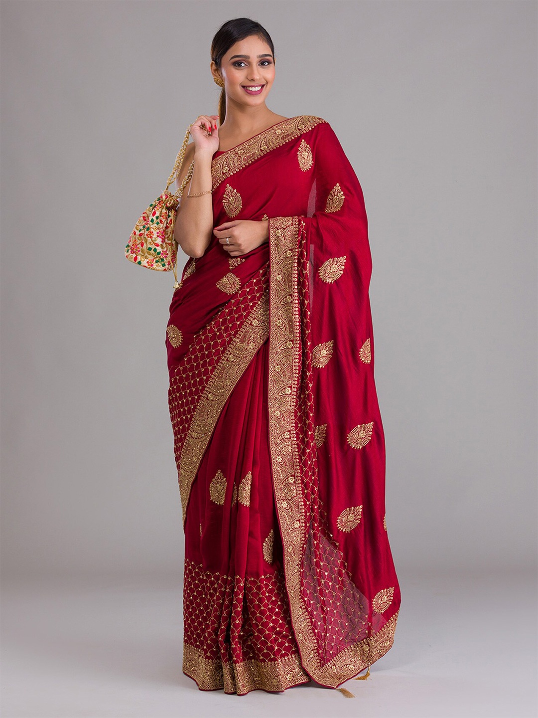 

Koskii Maroon & Gold-Toned Ethnic Motifs Zari Heavy Work Saree