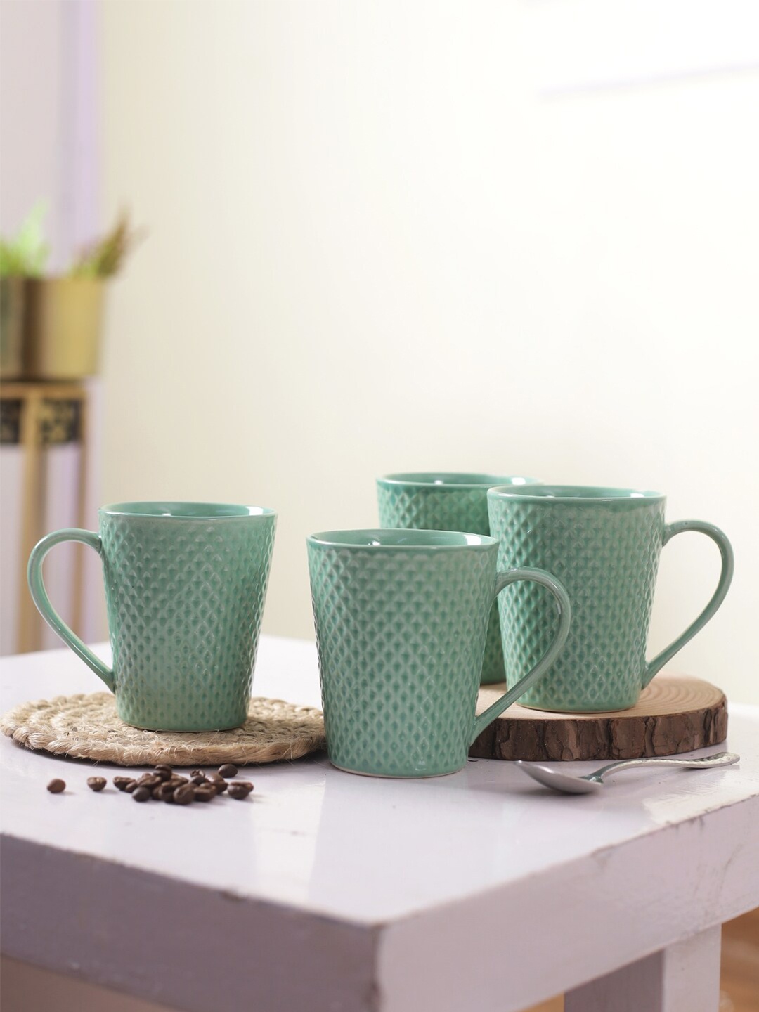 

Aapno Rajasthan Sea Green Set of 4 Textured Ceramic Glossy Mugs 300 ml Each