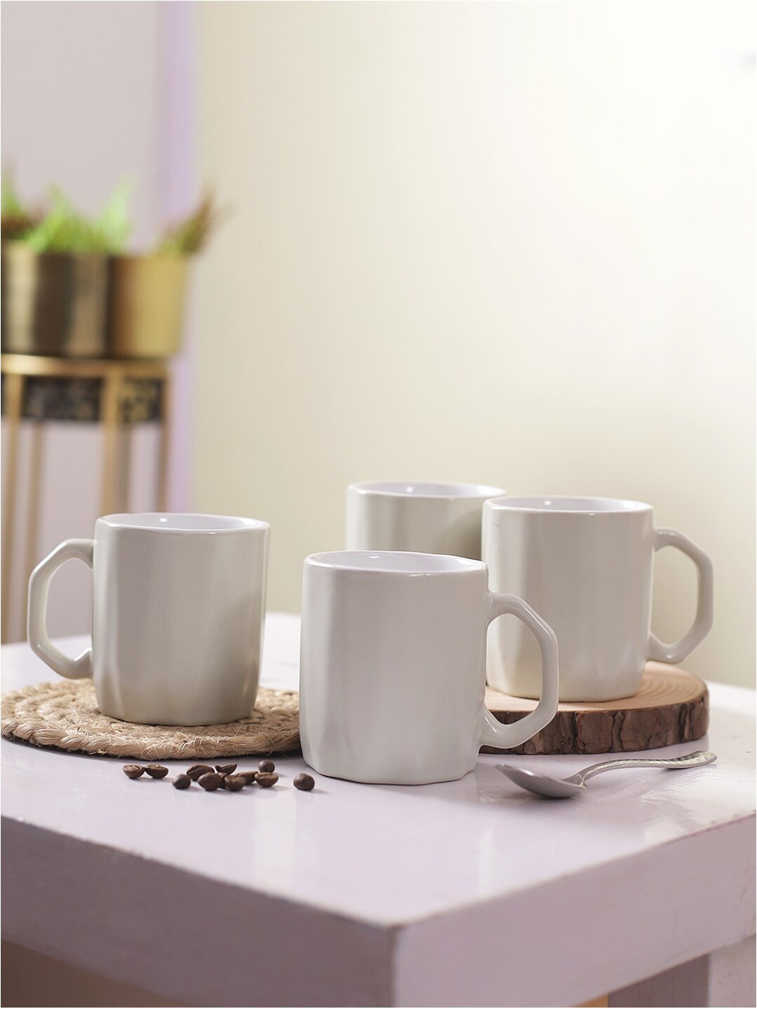 

Aapno Rajasthan White Set Of 4 Ceramic Glossy Cups 250 ml Each