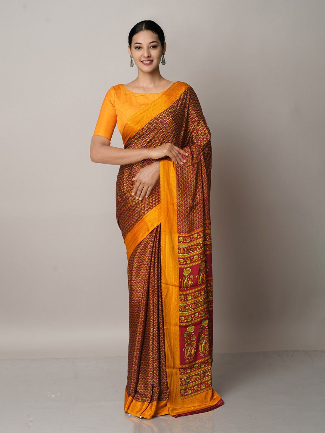 

Unnati Silks Brown & Orange Ethnic Motifs Block Print Saree