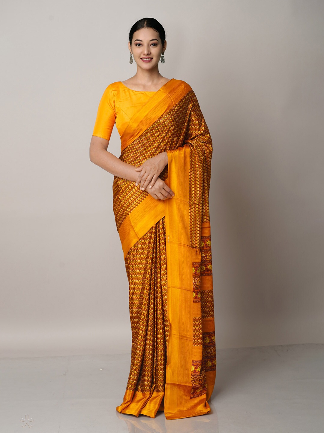 

Unnati Silks Brown & Yellow Floral Block Print Saree