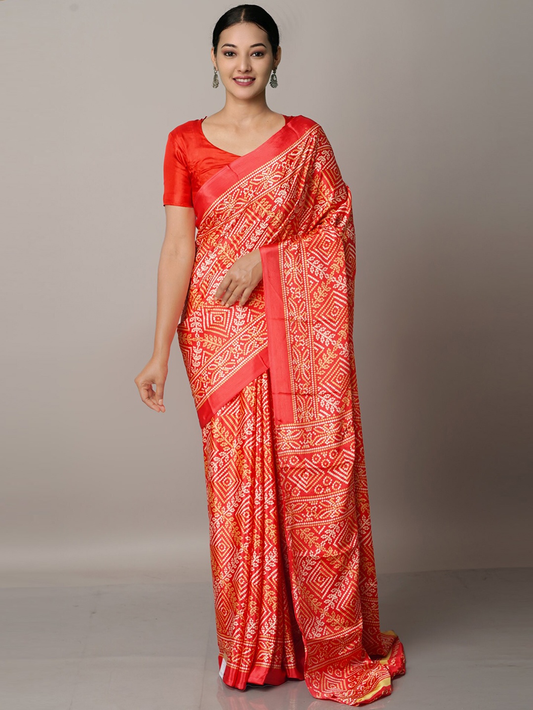 

Unnati Silks Red & Off White Bandhani Saree