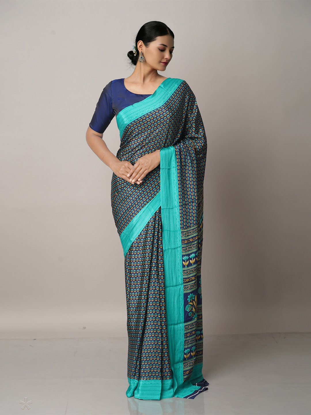 

Unnati Silks Blue & Mustard Floral Block Print Saree