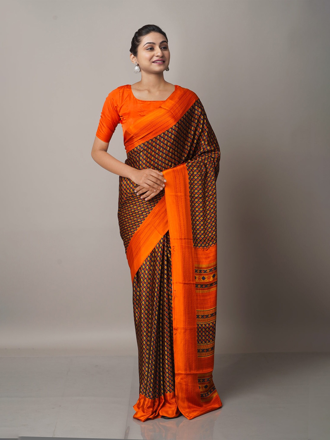 

Unnati Silks Brown & Orange Ethnic Motifs Block Print Saree