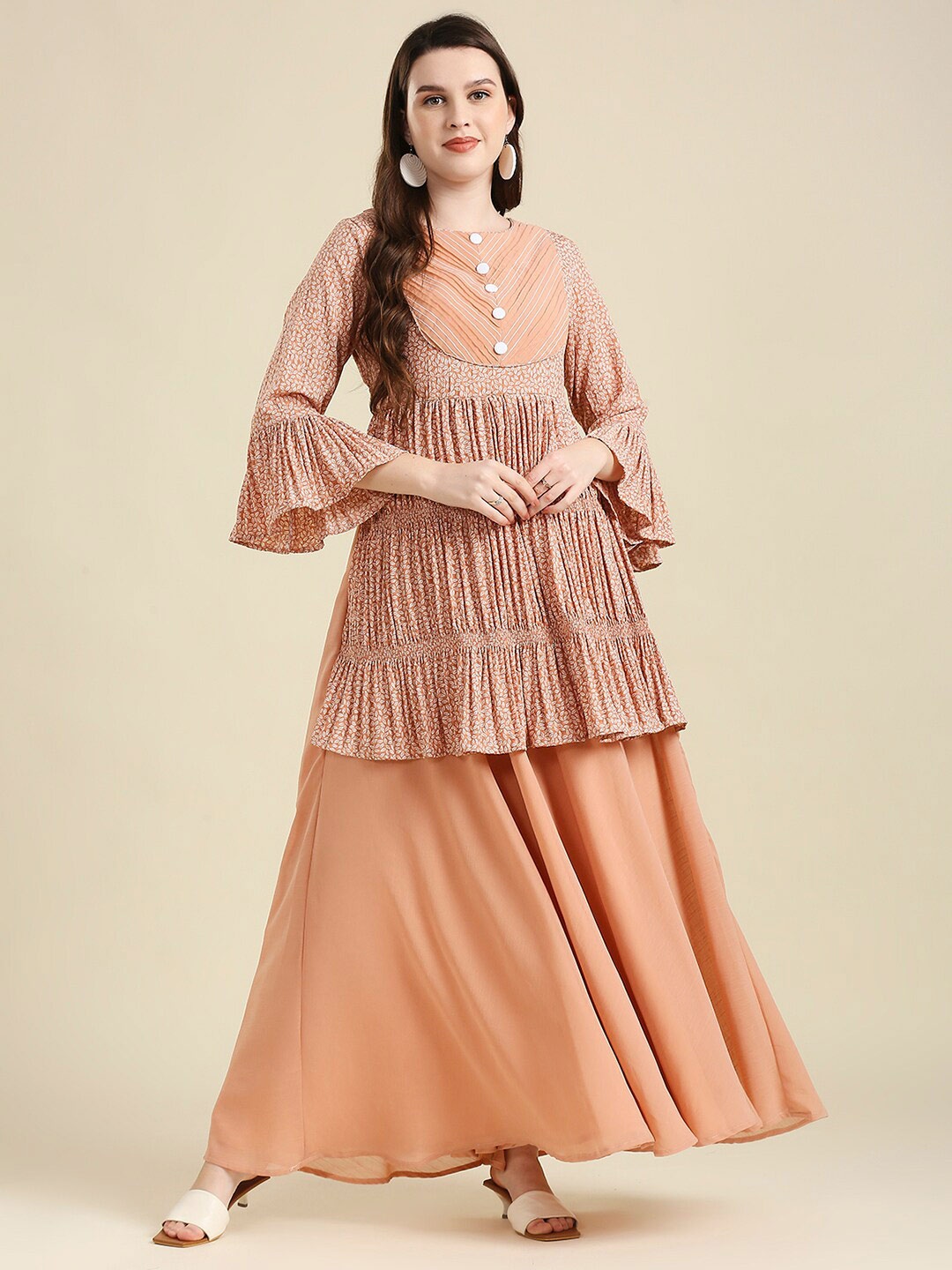 

MADHURAM Women Peach-Coloured Floral Printed Bell Sleeves Tiering Georgette Kurta