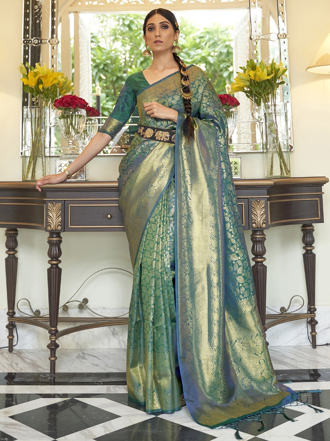 

Mitera Teal & Blue Woven Design Zari Silk Blend Saree