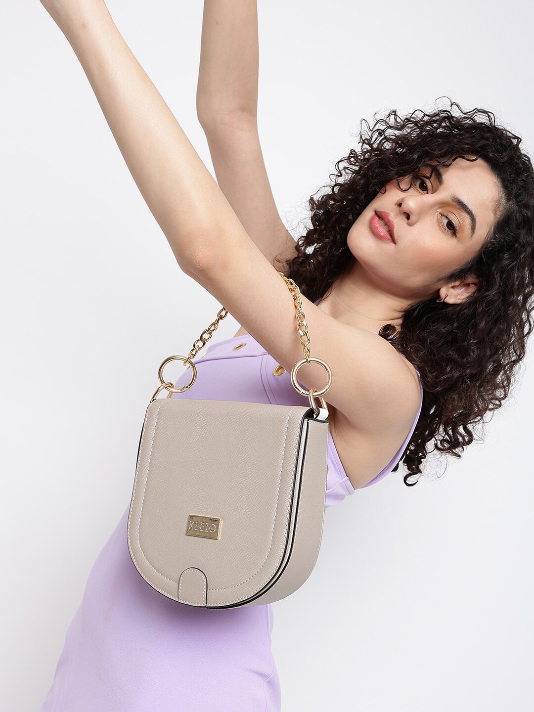 

KLEIO Women Textured Swagger Sling Bag With Tasselled Detail, Cream