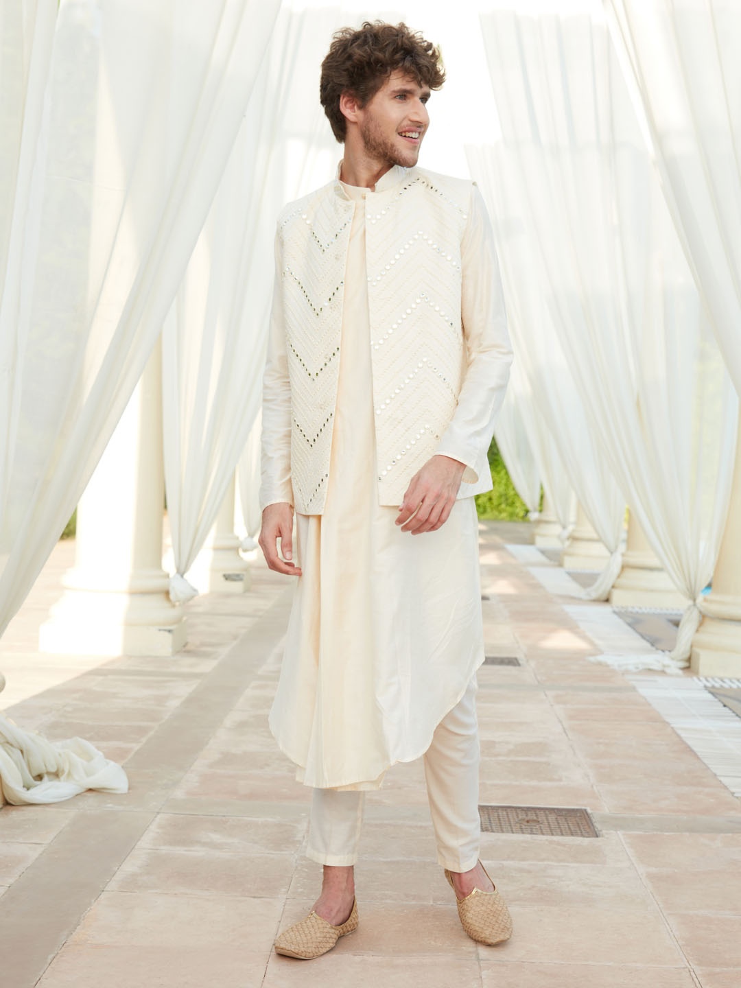 

VASTRAMAY Men Angrakha Solid Kurta With Churidar & Mirror Work Nehru Jacket, Cream