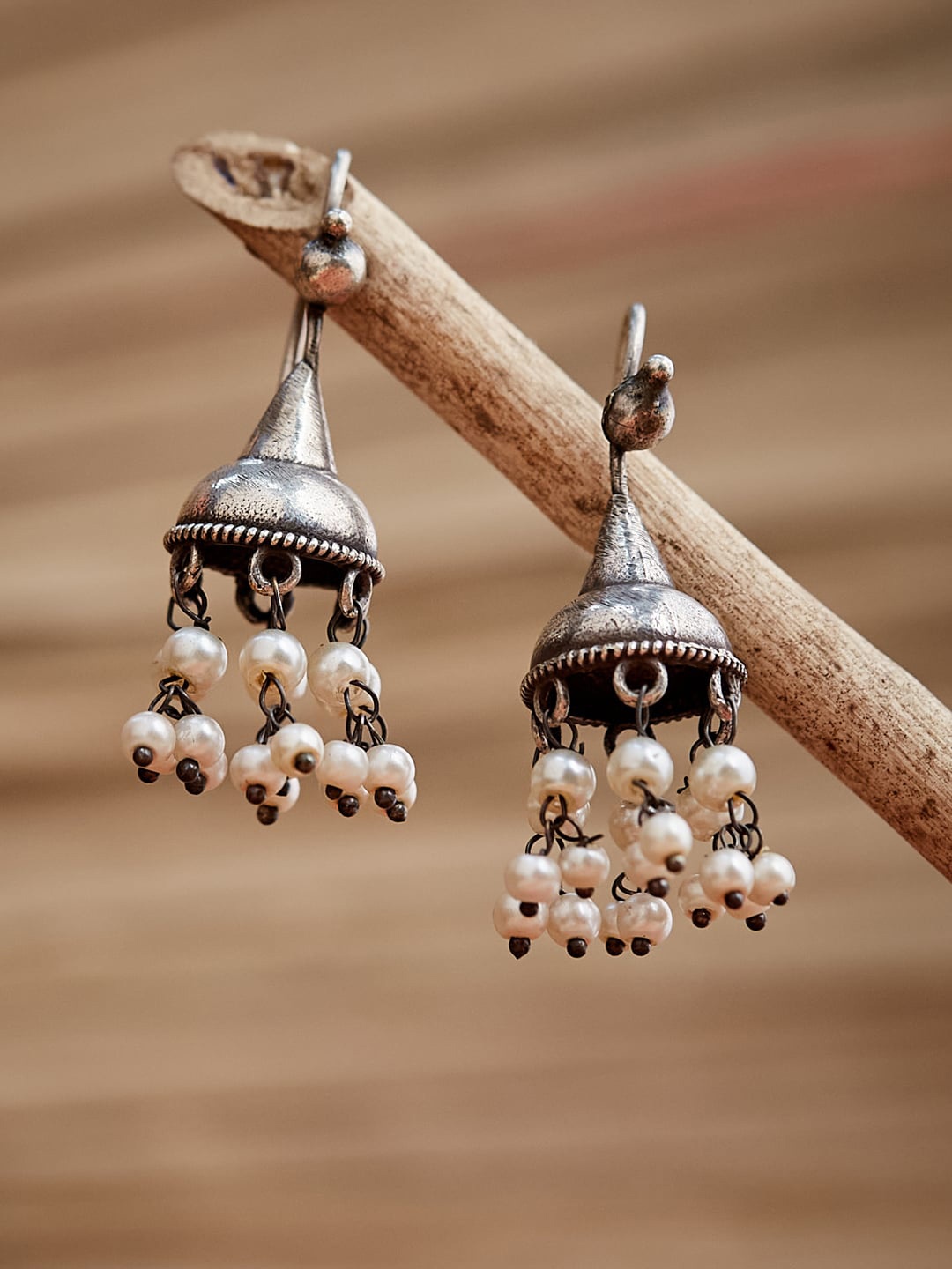 

ATIBELLE Silver-Toned Contemporary Jhumkas Earrings with Beads drop