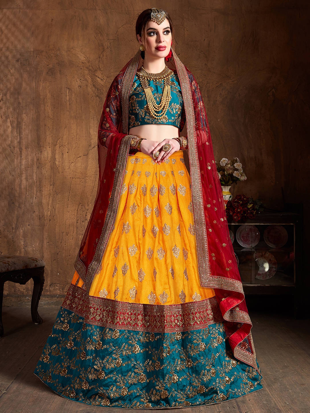 

FABPIXEL Women Yellow & Teal Embroidered Semi-Stitched Lehenga Choli Set