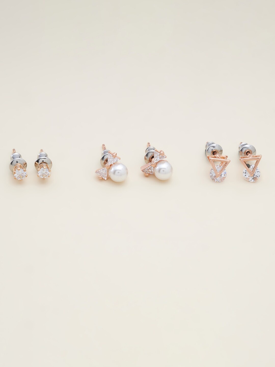 

Kushal's Fashion Jewellery Women White & Gold-Toned Triangular Studs Earrings
