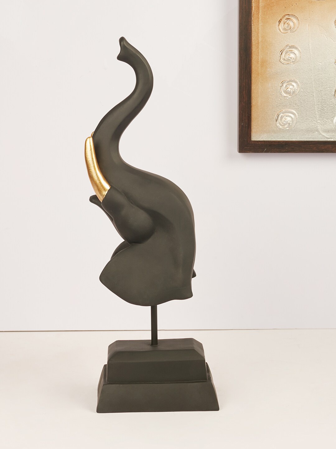 

HomeTown Gold-Toned & Black Solid Polyresin Modern Elephant Face Figurine Showpieces